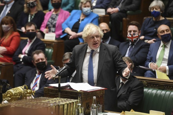 In this photo issued by UK Parliament, Britain&#039;s Prime Minister Boris Johnson speaks during Prime Minister&#039;s Questions in the House of Commons, London, Wednesday Dec. 15, 2021. (Jessica Tayl ...