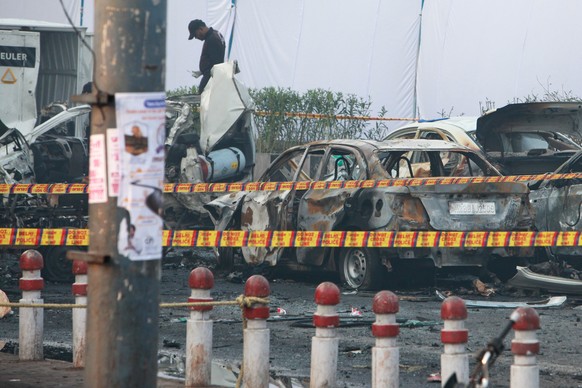 An investigator examines the site of Monday&#039;s car explosion near the historic Red Fort, in New Delhi, India, Tuesday, Nov. 11, 2025. (AP Photo)
India Car Blast