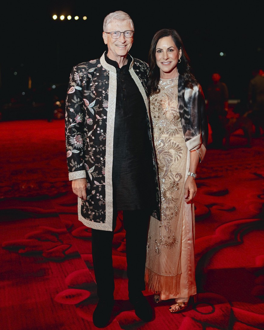 This photo released by the Reliance group shows Bill Gates and Paula Hurd posing for a photo during the wedding celebration of Mukesh Ambani's son Anant Ambani in Jamnagar, India, Saturday, March 0…