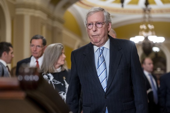 epa10352732 Senate Minority Leader Mitch McConnell walks to a press briefing following a Republican luncheon in the US Capitol in Washington, DC, USA, 06 December 2022. Leader McConnell criticized for ...