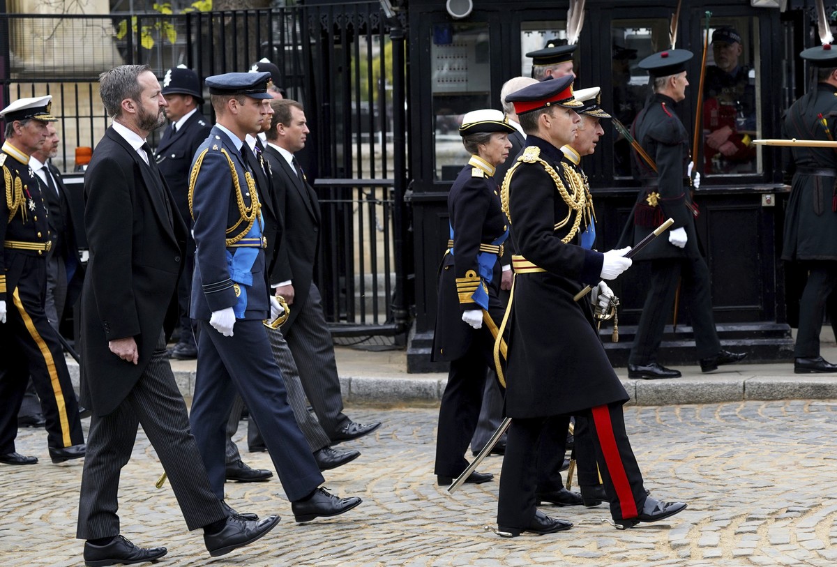 Britain's King Charles III, Princess Anne, Prince Andrew and Prince Edward walk as the coffin of Queen Elizabeth II leaves Westminster Hall for the State Funeral at Westminster Abbey, London Mond ...