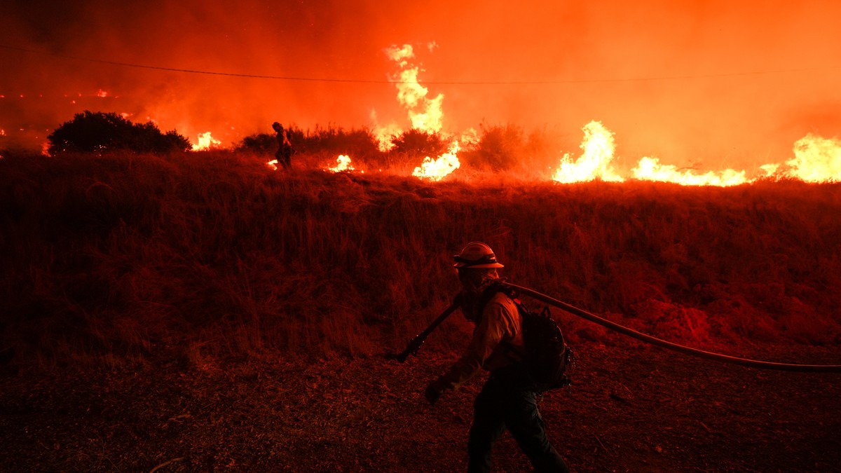 FILE - A firefighter monitors flames caused by the Hughes Fire along Castaic Lake in Castaic, Calif., Jan. 22, 2025. (AP Photo/Jae C. Hong, File)
Climate El Nino