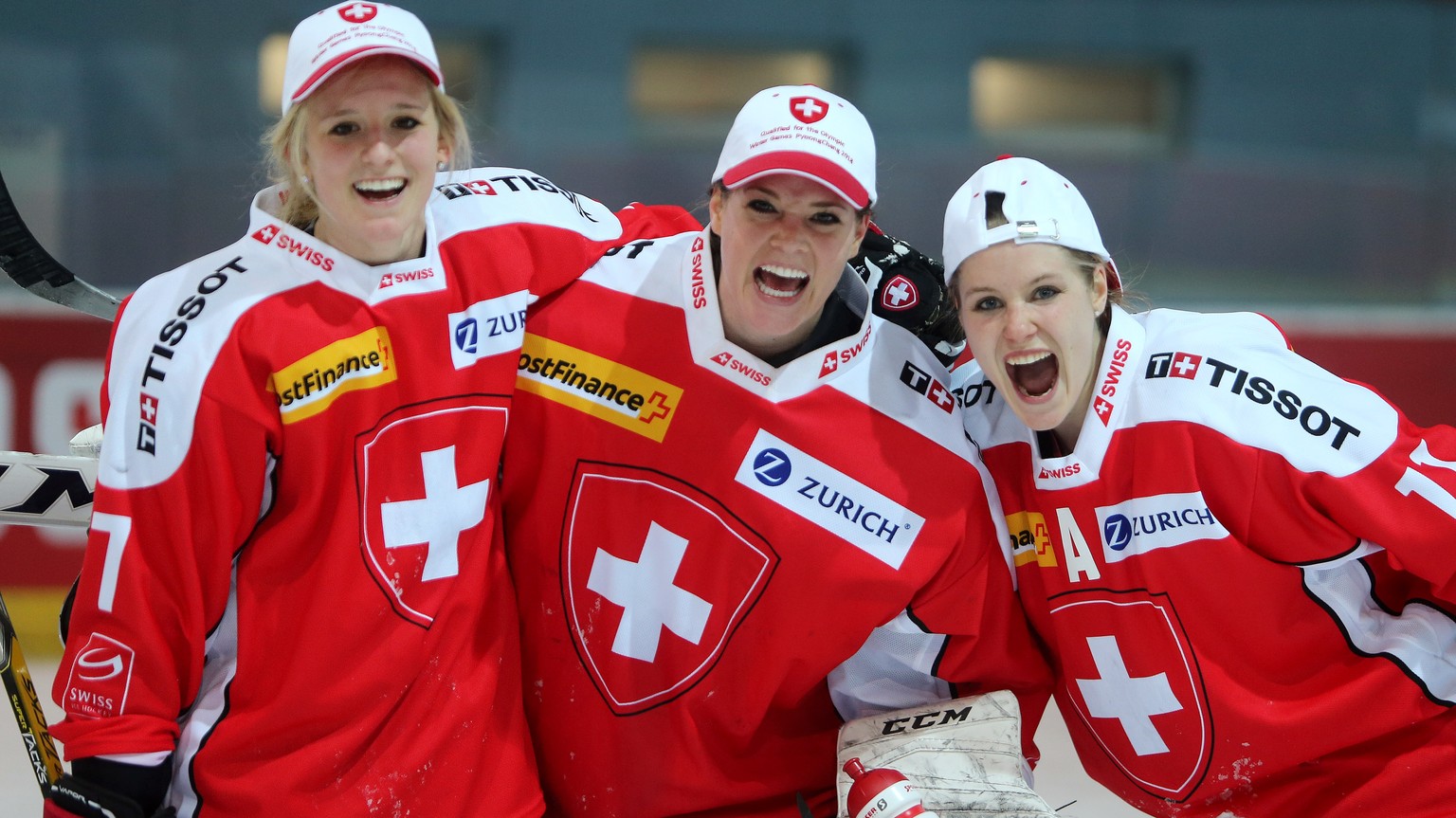 Switzerland&#039;s Lara Stalder, Florence Schelling, and Sabrina Zollinger, from left, rejoice after winning against Czech Republic and qualifying for the Pyeongchang Winter Olympics, during the women ...