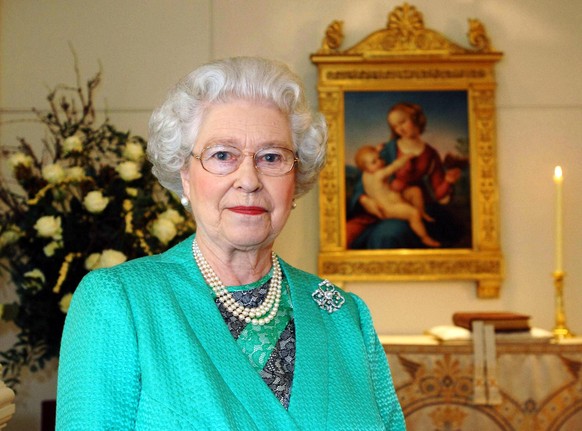 LONDON - DECEMBER 24: (NO PUBLICATION IN UK MEDIA FOR 28 DAYS) Queen Elizabeth II gives her Christmas speech to the nation in the Chapel at Buckingham Palace where she recorded her Christmas broadcast ...