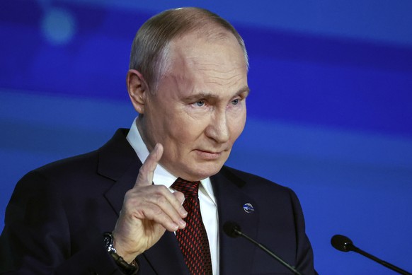 epa11707732 Russian President Vladimir Putin delivers a speech during a plenary session as part of the 21st annual meeting of the Valdai Discussion Club titled &#039;Lasting peace on what basis? Commo ...