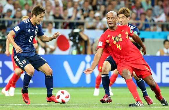 epa06859051 Genki Haraguchi (L) of Japan in action against Vincent Kompany (R) of Belgium during the FIFA World Cup 2018 round of 16 soccer match between Belgium and Japan in Rostov-On-Don, Russia, 02 ...