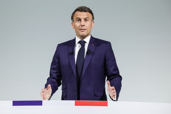 epa11405479 French President Emmanuel Macron holds a press conference about his decision to dissolve the parliament and calling for elections, in Paris, France, 12 June 2024. President Macron called f ...
