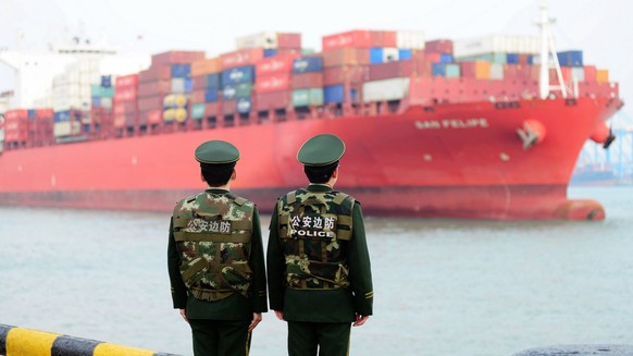 epa06644667 (FILE) - Border guards work at a container port in Qingdao, Shandong province, China, 08 March 2018 (issued 04 April 2018). China will place 25 percent tariffs on a list of 106 US goods, i ...