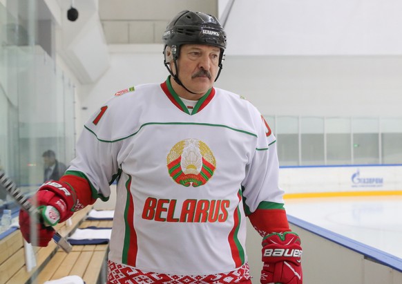 epa08200596 Belarus President Alexander Lukashenko takes part in a friendly ice hockey match with Russian President Vladimir Putin (not pictured) in the Black Sea resort of Sochi, Russia, 07 February  ...