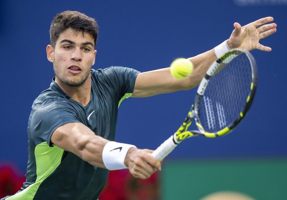 FILE - Carlos Alcaraz, of Spain, hits a return to Tommy Paul, of the United States, during the National Bank Open men&#039;s tennis tournament Friday, Aug. 11, 2023, in Toronto. Alcaraz is one of the  ...