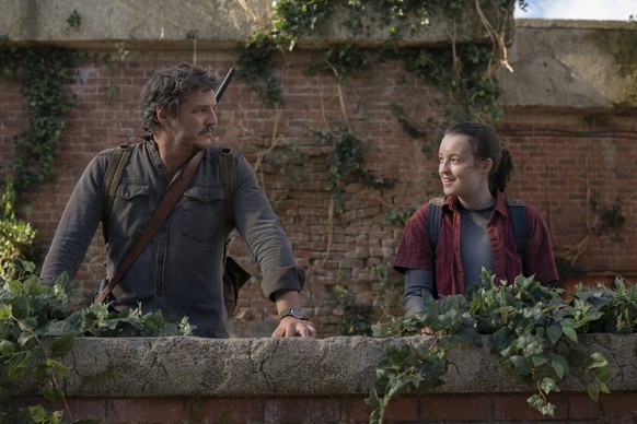 This image released by HBO shows Pedro Pascal, left, and Bella Ramsey in a scene from &quot;The Last of Us.&quot; (HBO via AP)