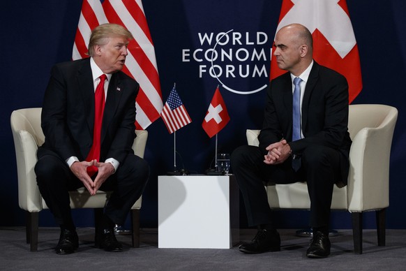 U.S. President Donald Trump, left, meets with Swiss President Alain Berset at the World Economic Forum, Friday, Jan. 26, 2018, in Davos, Switzerland. (AP Photo/Evan Vucci)