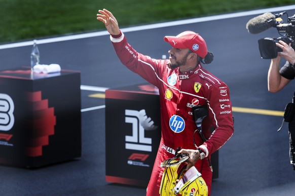 epa11980257 Scuderia Ferrari driver Lewis Hamilton of Britain reacts after winning the Sprint race at the Shanghai International Circuit in Shanghai, China, 22 March 2025. The 2025 Formula 1 Chinese G ...