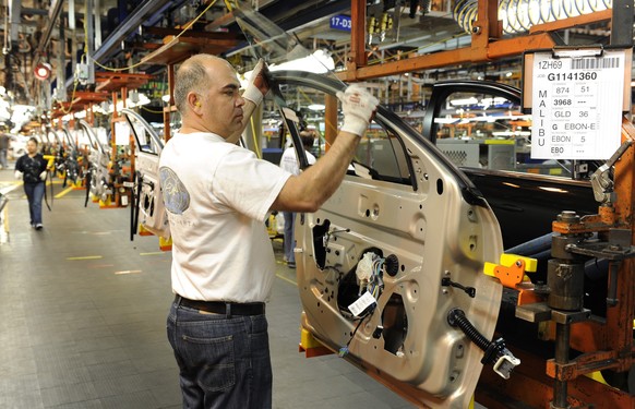 United Auto Worker Thomas Ruiz installs a window on a Malibu door at the General Motors Fairfax Assembly Plant in Kansas City, Kansas, in this April 1, 2009 file photo. The Chevrolet Malibu has been a ...