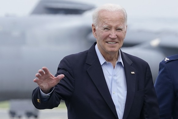 President Joe Biden waves to members of the media as he walks to board Air Force One at Dover Air Force Base in Delaware, Sunday, July 9, 2023. Biden is heading to Europe to meet with King Charles III ...
