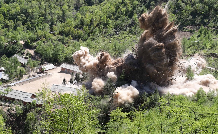 epa06761540 Earth is displaced during an explosion on the first day of dismantling at North Korea&#039;s Punggye-ri nuclear test site in Punggye-ri, North Korea, 24 May 2018 (issued 25 May 2018). On 2 ...