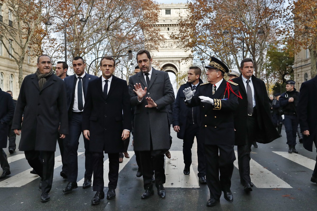 France's President Emmanuel Macron, centre left, France's Interior Minister Christophe Castaner, center, Secretary of State to the Interior Minister Laurent Nunez, left, and Paris police Pre ...