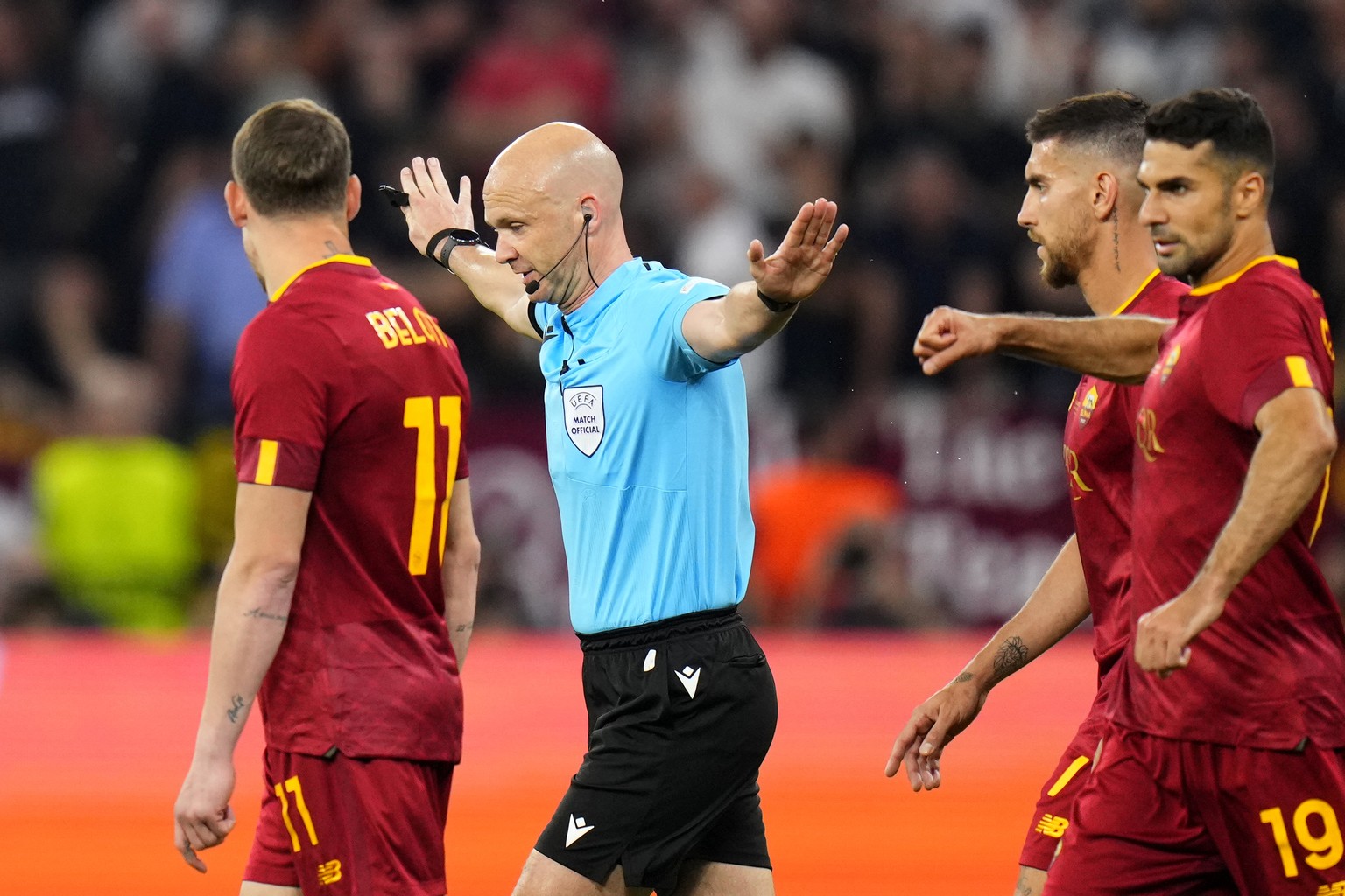 Referee Anthony Taylor signals no penalty for Sevilla after checking the VAR during the Europa League final soccer match between Sevilla and Roma, at the Puskas Arena in Budapest, Hungary, Wednesday,  ...