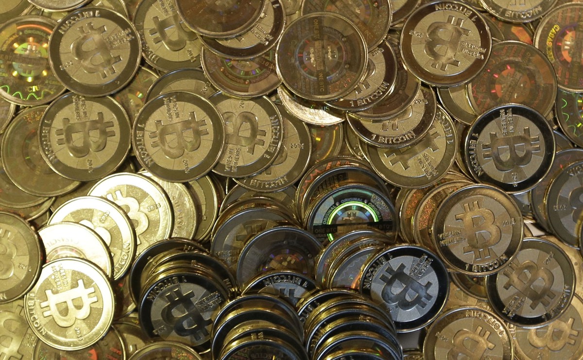 FILE - This April 3, 2013 file photo, shows bitcoin tokens at 35-year-old software engineer Mike Caldwell's shop in Sandy, Utah. Mexico's Central Bank issued a public warning Monday, June 28 ...