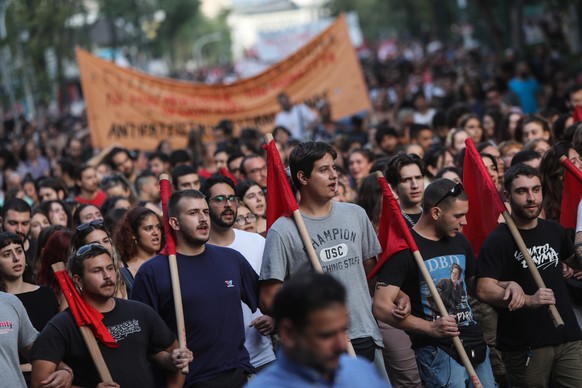 epa10693728 People take part in a protest over the loss of hundreds of asylum seekers who were aboard a boat that capsized off the coast of Peloponnese, in Athens, Greece, 15 June 2023. A total of 104 ...