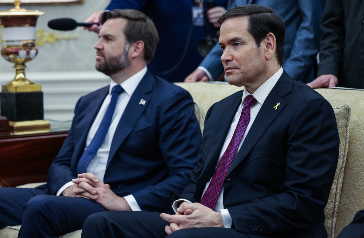 epa12437905 US Secretary of State Marco Rubio (R), and US Vice president JD Vance (L) look on as President Donald Trump meets with Canadian Prime Minister Mark Carney in the Oval Office of the White H ...