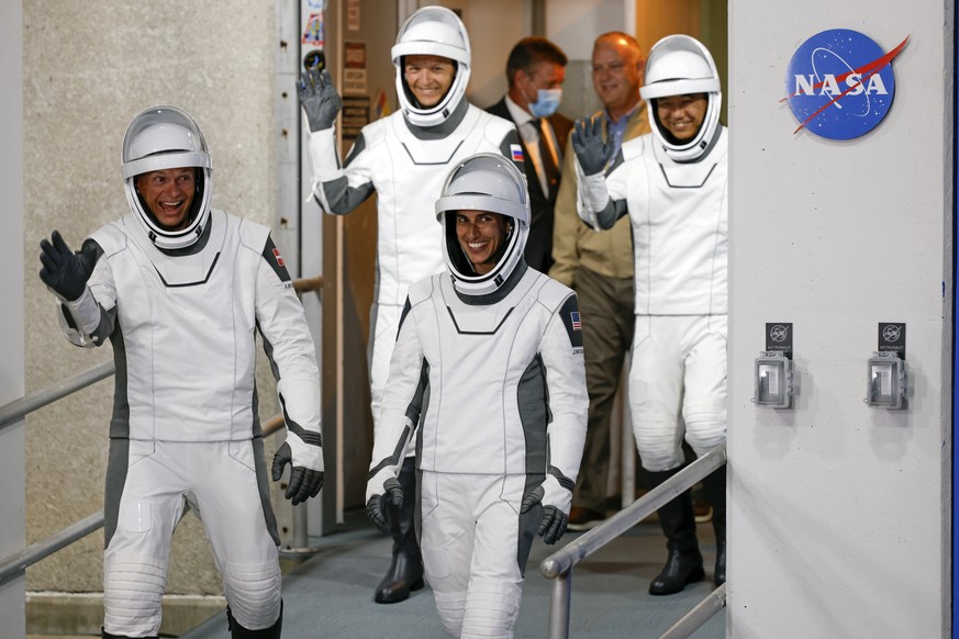 Danish astronaut Andreas Mogensen, left, front, NASA astronaut Jasmin Moghbeli, right front, Russian cosmonaut Konstantin Borisov, bck left, and Japanese astronaut Satoshi Furukawa leave the Operation ...