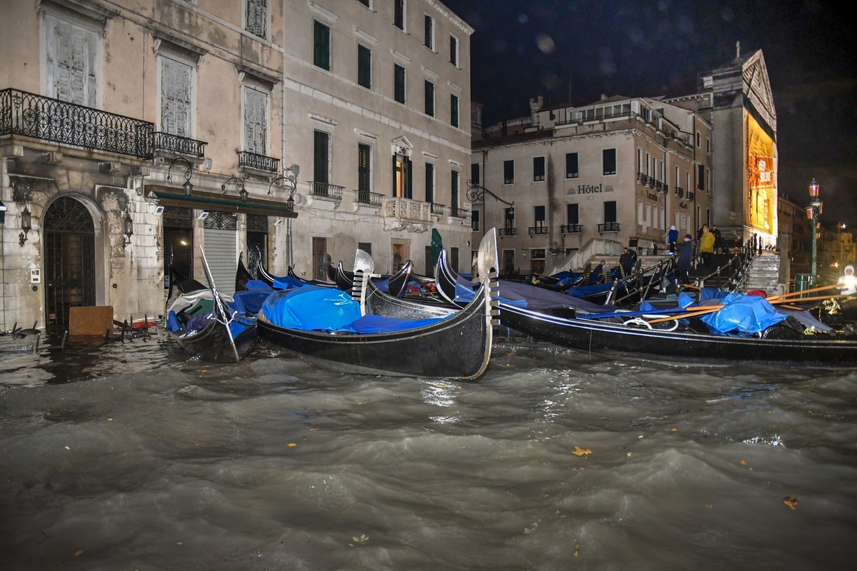 Stranded gondolas float adrift over the flooded banks, in Venice, Wednesday, Nov. 13, 2019. The mayor of Venice is blaming climate change for flooding in the historic canal city that has reached the s ...