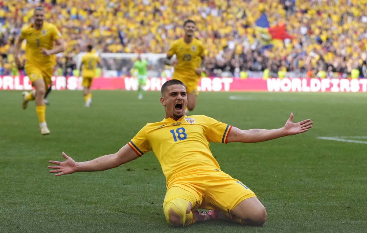 Romania's Razvan Marin celebrates scoring his side's 2nd goal during a Group E match between Romania and Ukraine at the Euro 2024 soccer tournament in Munich, Germany, Monday, June 17, 2024. ...