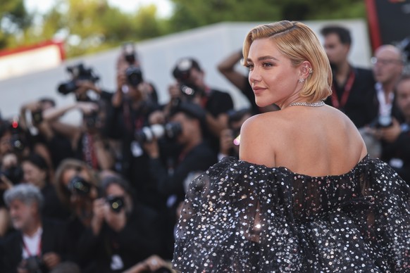 Florence Pugh poses for photographers upon arrival at the premiere of the film &#039;Don&#039;t Worry Darling&#039; during the 79th edition of the Venice Film Festival in Venice, Italy, Monday, Sept.  ...
