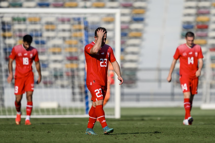 Switzerland's midfielder Xherdan Shaqiri, center, reacts next to Switzerland's defender Eray Coemert, left, and Switzerland's midfielder Michel Aebischer, right, during a friendly soccer match between ...