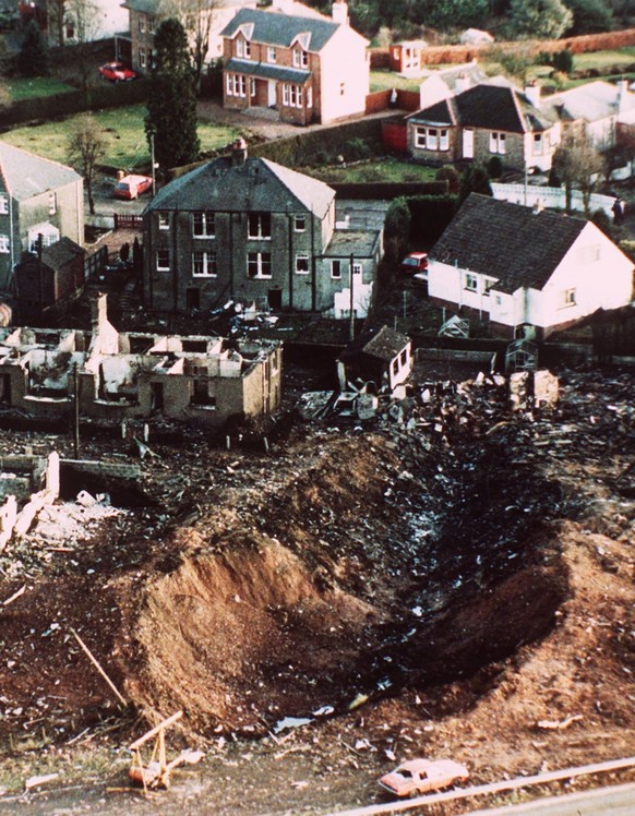 FILE - In this December 1988 file photo wrecked houses and a deep gash in the ground in the village of Lockerbie, Scotland, that was caused by the crash of Pan Am Flight 103. Scottish prosecutors said ...