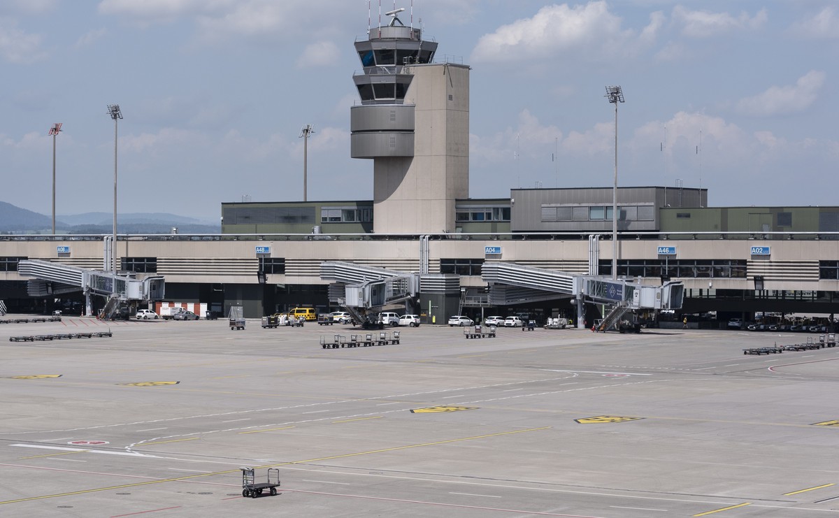 A few aircraft wait at the boarding gates on an almost empty tarmac on Friday 19 July 2024 at Zurich airport in Kloten, Switzerland. Due to a worldwide IT breakdown, check-in for air travellers and fl ...