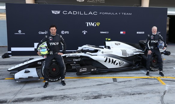 epa12725850 Cadillac driver Sergio Perez (L) of Mexico and Cadillac driver Valtteri Bottas (R) of Finland pose for team photo ahead the Formula 1 pre-season testing at Bahrain International Circuit in ...