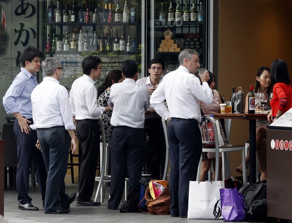 Ratlose Banker in Singapur.