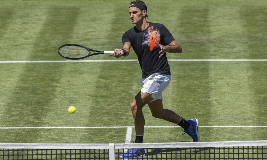 Roger Federer from Switzerland returns a shot during a training session for the Mercedes Cup in Stuttgart, Germany, Sunday, June 11, 2017. (Daniel Maurer/dpa via AP)