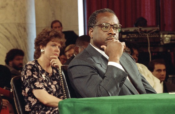FILE - In this Sept. 10, 1991, file photo, then-Supreme Court Justice Nominee Clarence Thomas and his wife Virginia listen during his nomination hearing before the Senate Judiciary Committee on Capito ...