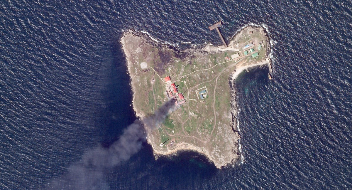 This satellite image taken by Planet Labs PBC shows thick black smoke rising after a suspected Ukrainian drone strike on Russian positions on Snake Island, Ukraine, in the Black Sea Friday, May 6, 202 ...