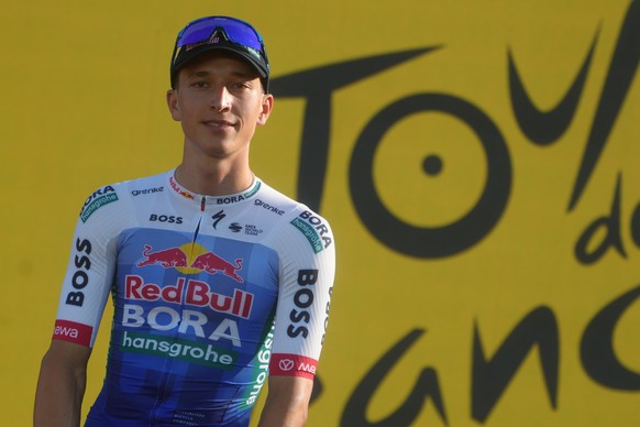 Florian Lipowitz of Germany poses on the podium during the team presentation two days ahead of the start of the Tour de France Cycling race in Barcelona, Spain, Thursday, July 2, 2026. (AP Photo/Thiba ...