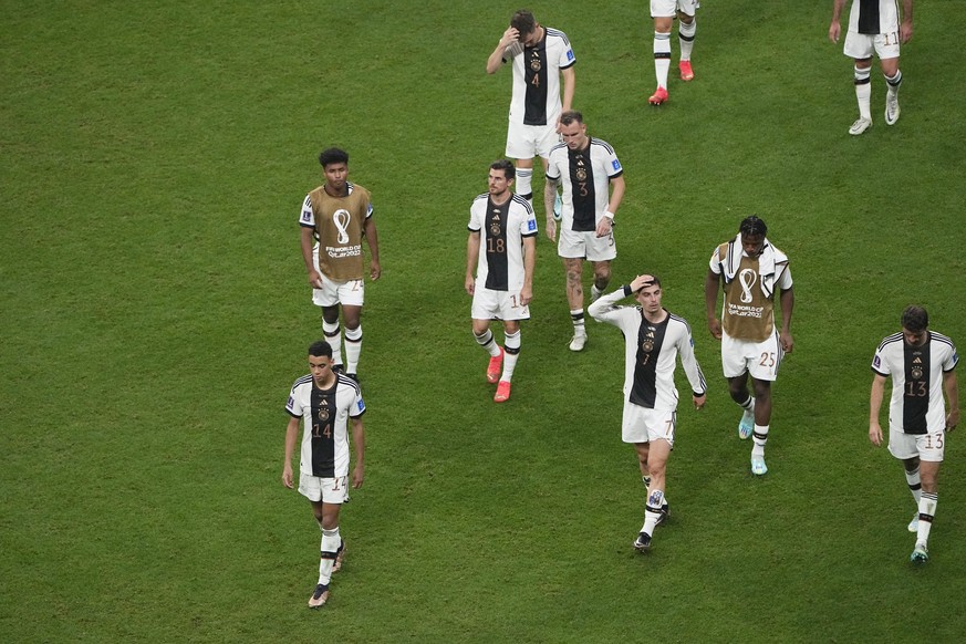 Germany's team players leave the pitch after the World Cup group E soccer match between Costa Rica and Germany at the Al Bayt Stadium in Al Khor, Qatar, Thursday, Dec. 1, 2022. (AP Photo/Ariel Schalit ...