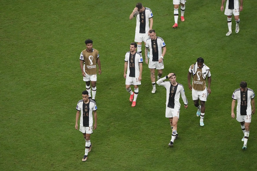 Germany&#039;s team players leave the pitch after the World Cup group E soccer match between Costa Rica and Germany at the Al Bayt Stadium in Al Khor, Qatar, Thursday, Dec. 1, 2022. (AP Photo/Ariel Sc ...