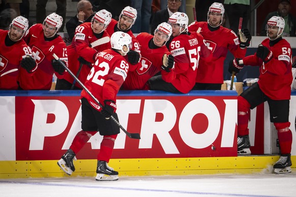 epa13001346 Switzerland's Denis Malgin celebrates scoring the 2-1 goal with teammates during the 2026 IIHF Men's Ice Hockey World Championship Quarterfinal game between Switzerland and Swede ...