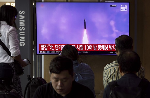 epa11378591 epa11378570 People watch a news segment on North Korea, at a station in Seoul, South Korea, 30 May 2024. According to South Korea&#039;s Joint Chiefs of Staff (JCS), North Korea launched s ...