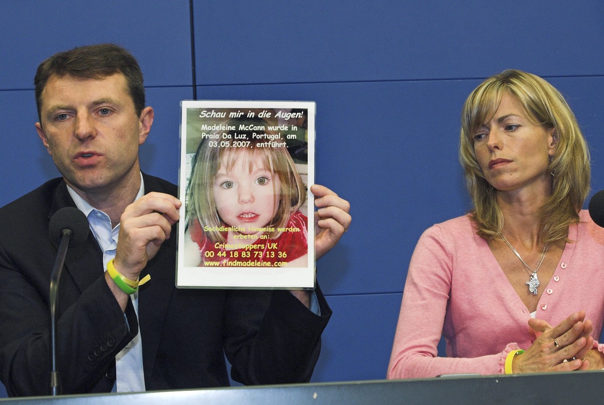 FILE - Gerry, left, and Kate McCann, parents of four-year old Madeleine McCann, missing from the Portuguese town of Praia Da Luz since May, present a picture of their daughter during a press conferenc ...
