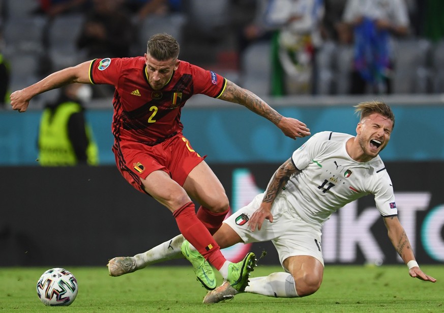 epa09319217 Toby Alderweireld (L) of Belgium in action against Ciro Immobile of Italy during the UEFA EURO 2020 quarter final match between Belgium and Italy in Munich, Germany, 02 July 2021. EPA/Andr ...