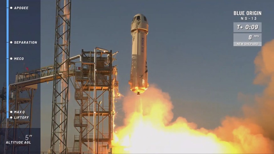 In this image from video made available by Blue Origin, the New Shepard rocket lifts off from its launchpad in Texas, to test new lunar-landing technology for NASA that could help put astronauts back  ...