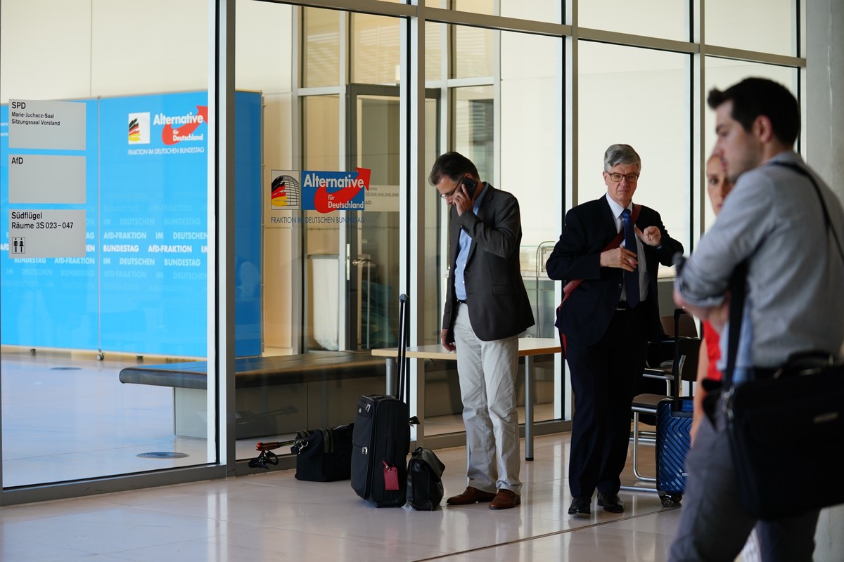 epa07680371 MPs of right-wing populist party Alternative for Germany (AfD) stand outside their Bundestag faction's meeting room, in Berlin, Germany, 28 June 2019. The retreat of the AfD Bundestag ...