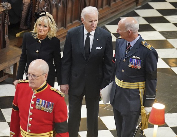 US President Joe Biden, center, and First Lady Jill Biden arrive for the funeral service of Queen Elizabeth II at Westminster Abbey in central London, Monday Sept. 19, 2022. The Queen, who died aged 9 ...