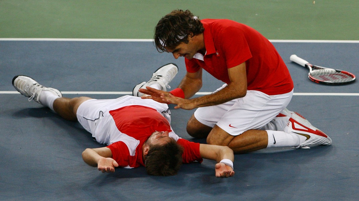 BEIJING - AUGUST 16: Roger Federer (right) and Stanislas Wawrinka of Switzerland celebrate after defeating Thomas Johansson and Simon Aspelin of Sweden during the men's doubles gold medal tennis  ...