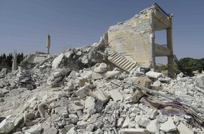A general view shows damage at a base of the al Qaeda-linked Nusra Front, that was targeted by what activists said were U.S.-led air strikes in Reef al-Mohandeseen al-Thani in Aleppo September 27, 201 ...