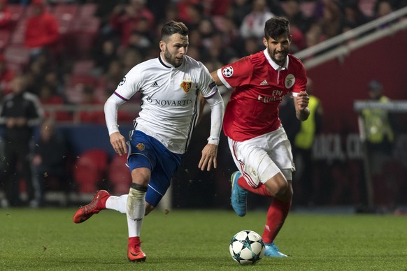 Basel&#039;s Renato Steffen, left, fights for the ball against Benfica&#039;s Lisandro Lopez, right, during the UEFA Champions League Group stage Group A matchday 6 soccer match between Portugal&#039; ...